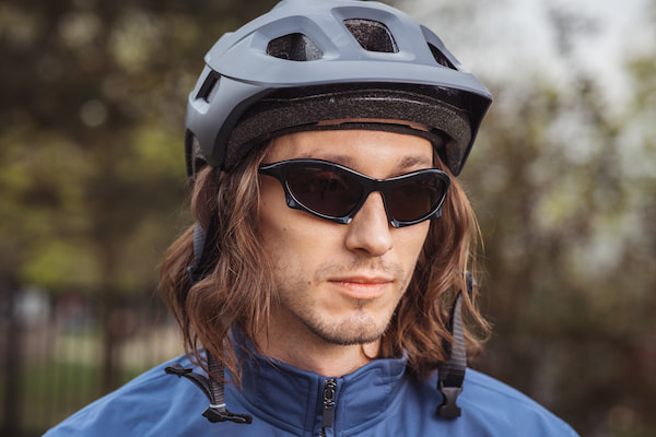 Young man with futuristic sports sunglasses